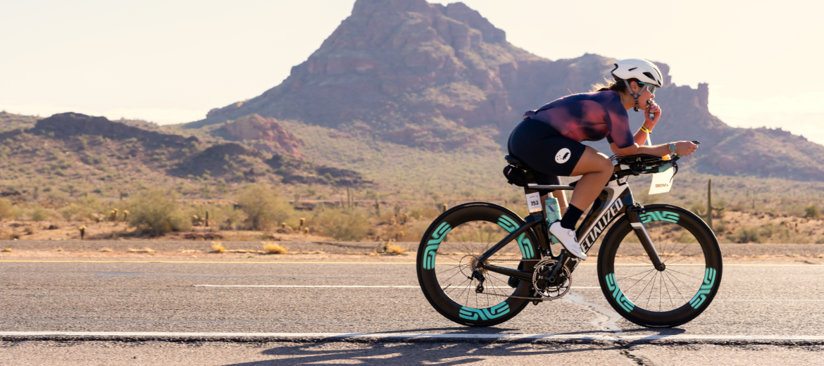 Athlete in Arizona biking at sunset
