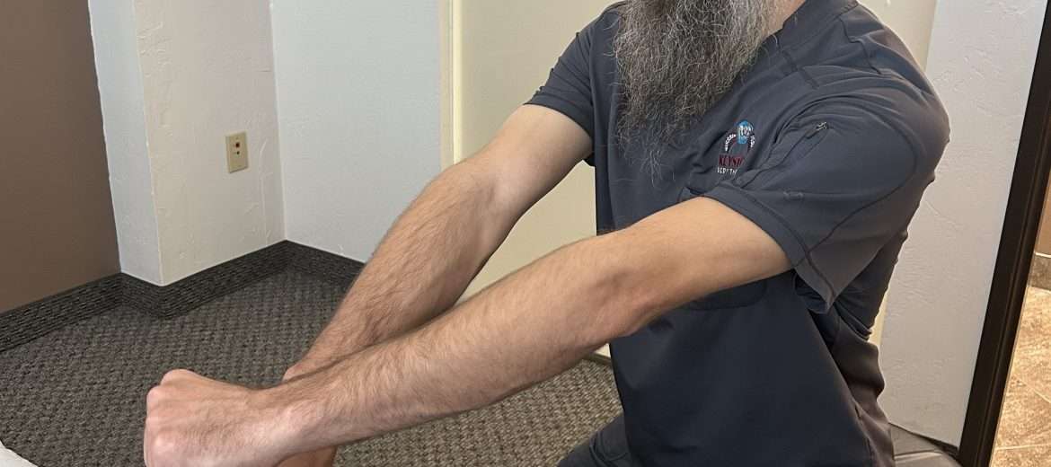 Clinical therapeutic bodywork on foot and calf for ankle pain