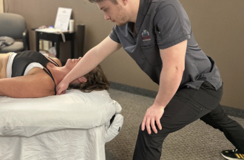 Therapist performing monthly massage therapy session