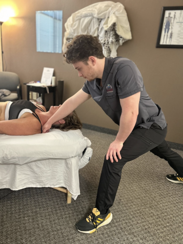 Therapist performing monthly massage therapy session
